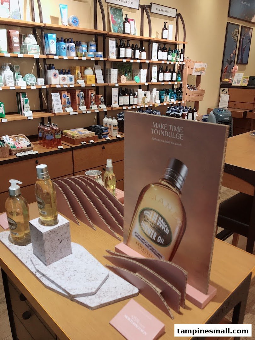 An interior shot of L'Occitane, showcasing shelves filled with skincare products and a prominent display table.