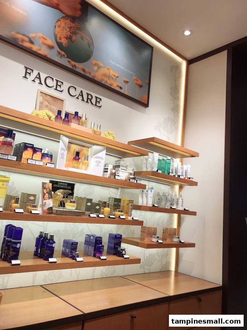 An interior shot of L'Occitane, showcasing a wide range of face care products on well-lit wooden shelves.