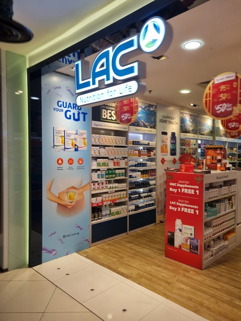 The brightly lit storefront of LAC Nutrition For Life, showcasing health supplements and promotions.
