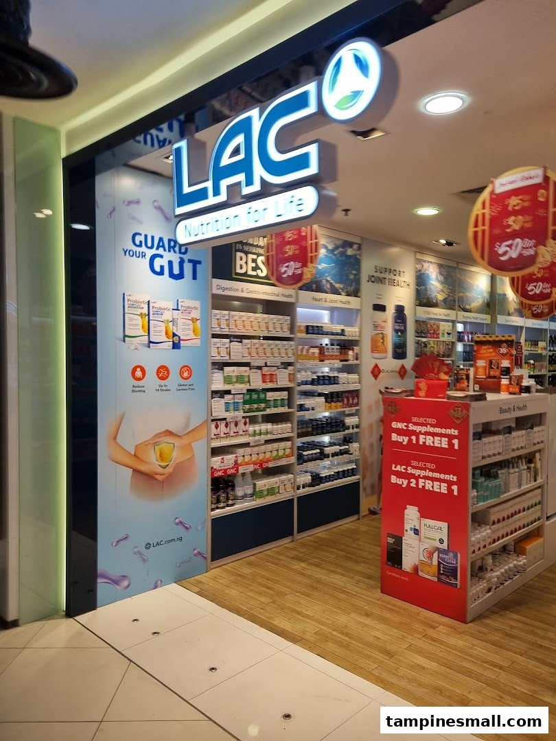 The brightly lit storefront of LAC Nutrition For Life, showcasing health supplements and promotions.