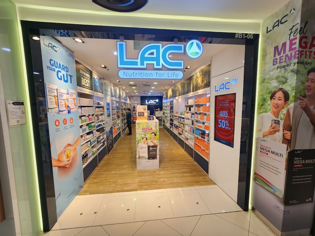 The image shows the brightly lit entrance of LAC Nutrition For Life, displaying various health supplements.