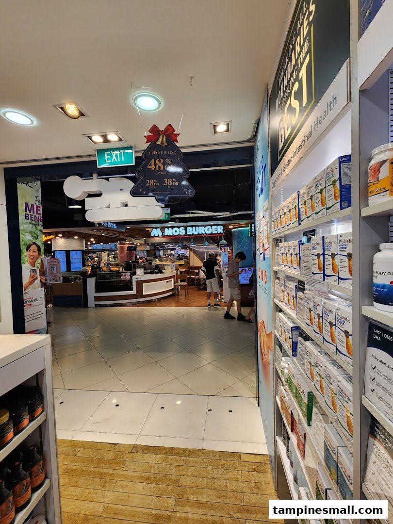 Interior view of LAC Nutrition For Life, showcasing health supplements and an exit leading to a food court.