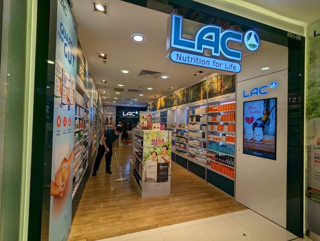 The storefront of LAC Nutrition For Life, a health and wellness shop, with products displayed inside.