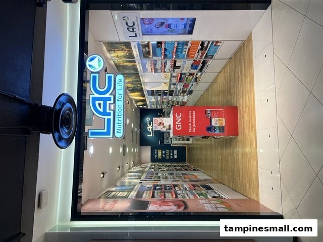 The image shows the brightly lit entrance of LAC Nutrition For Life, with shelves of products visible inside.