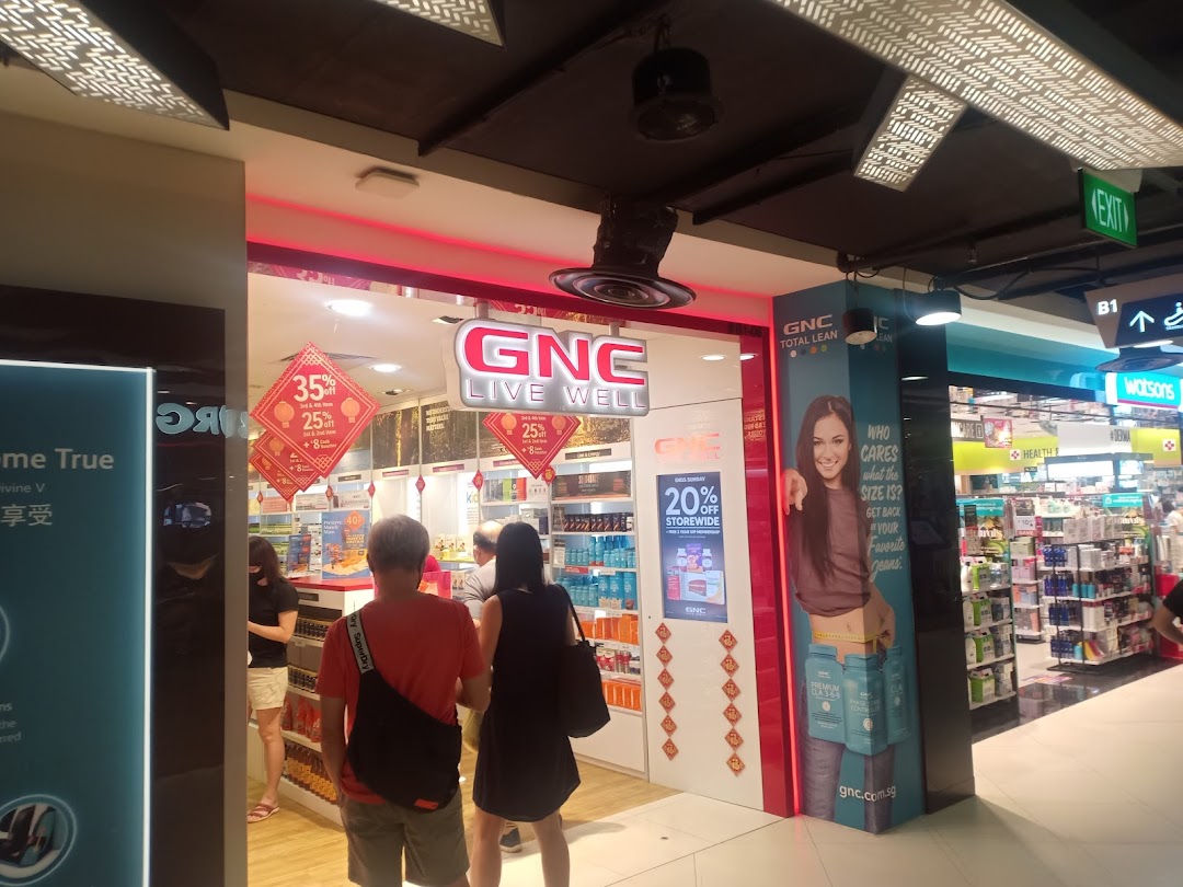 The inviting storefront of a nutrition and wellness shop, featuring health products and customers entering.