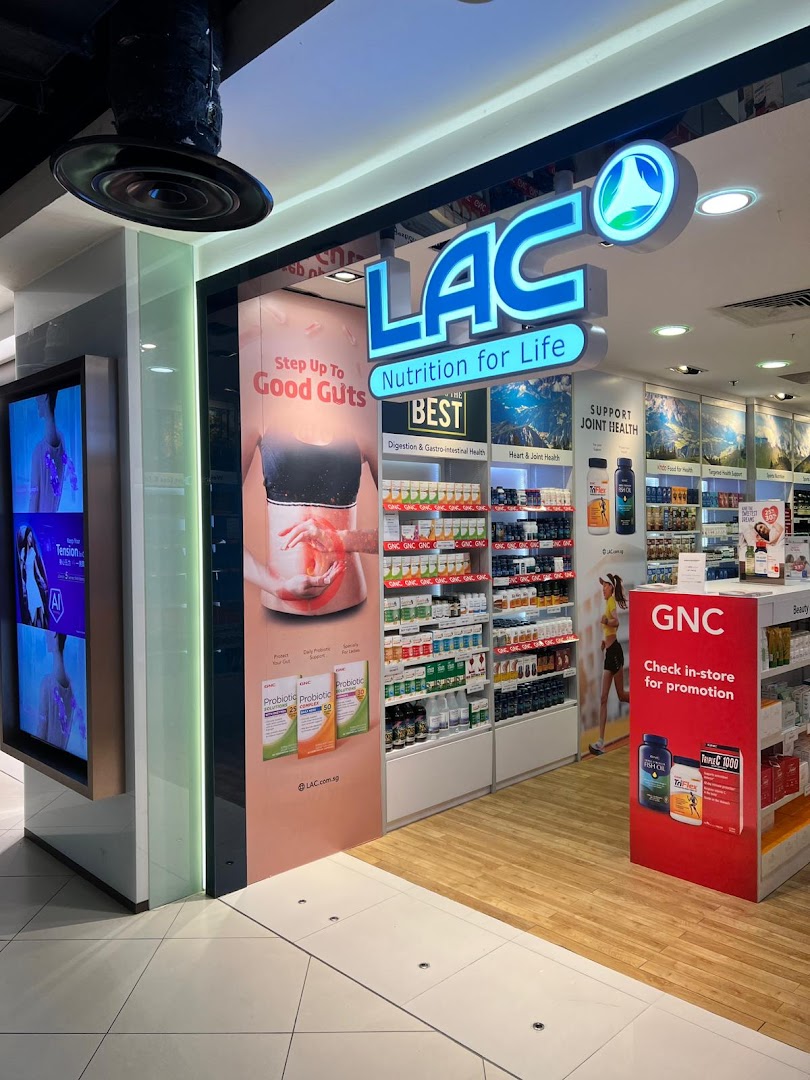 The entrance of LAC Nutrition For Life, showcasing health supplements and promotional displays.