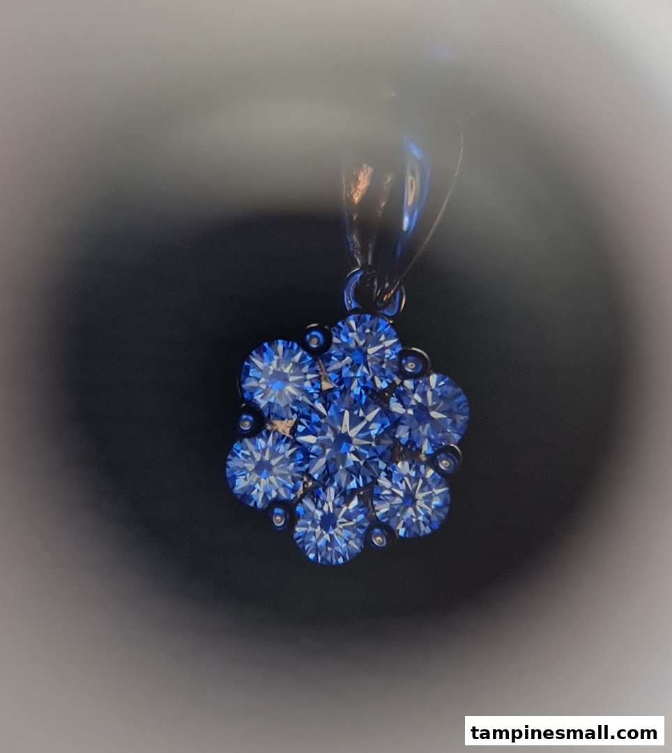 A close-up of a stunning blue gemstone cluster pendant from Lee Hwa Jewellery.