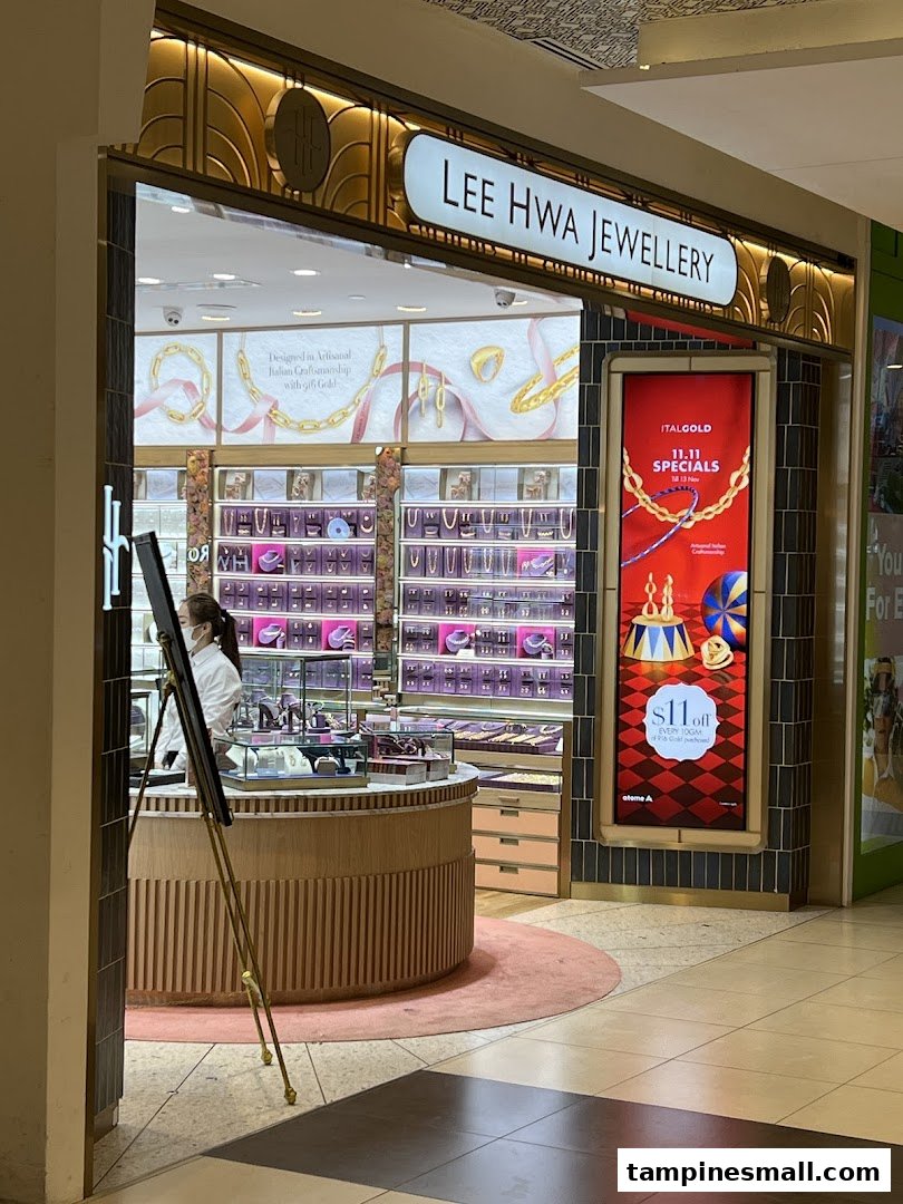 The image shows the elegant entrance and interior display of Lee Hwa Jewellery, featuring sparkling items.