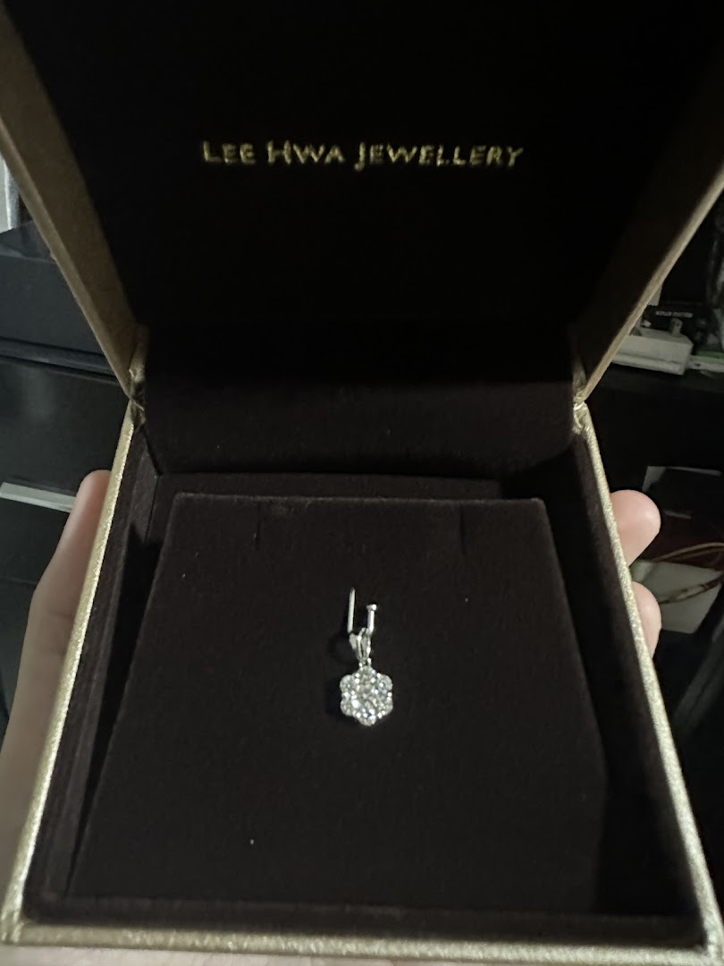 A sparkling diamond pendant displayed in a luxurious Lee Hwa Jewellery box.
