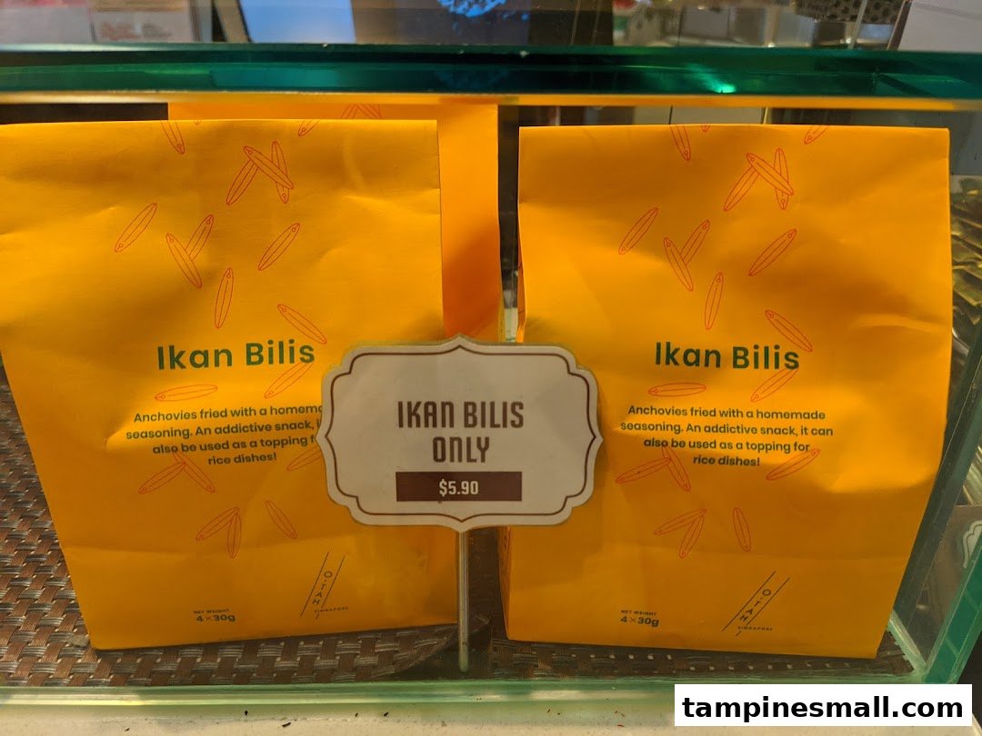 Two yellow bags of Lee Wee Brothers' Ikan Bilis are displayed with a price tag.
