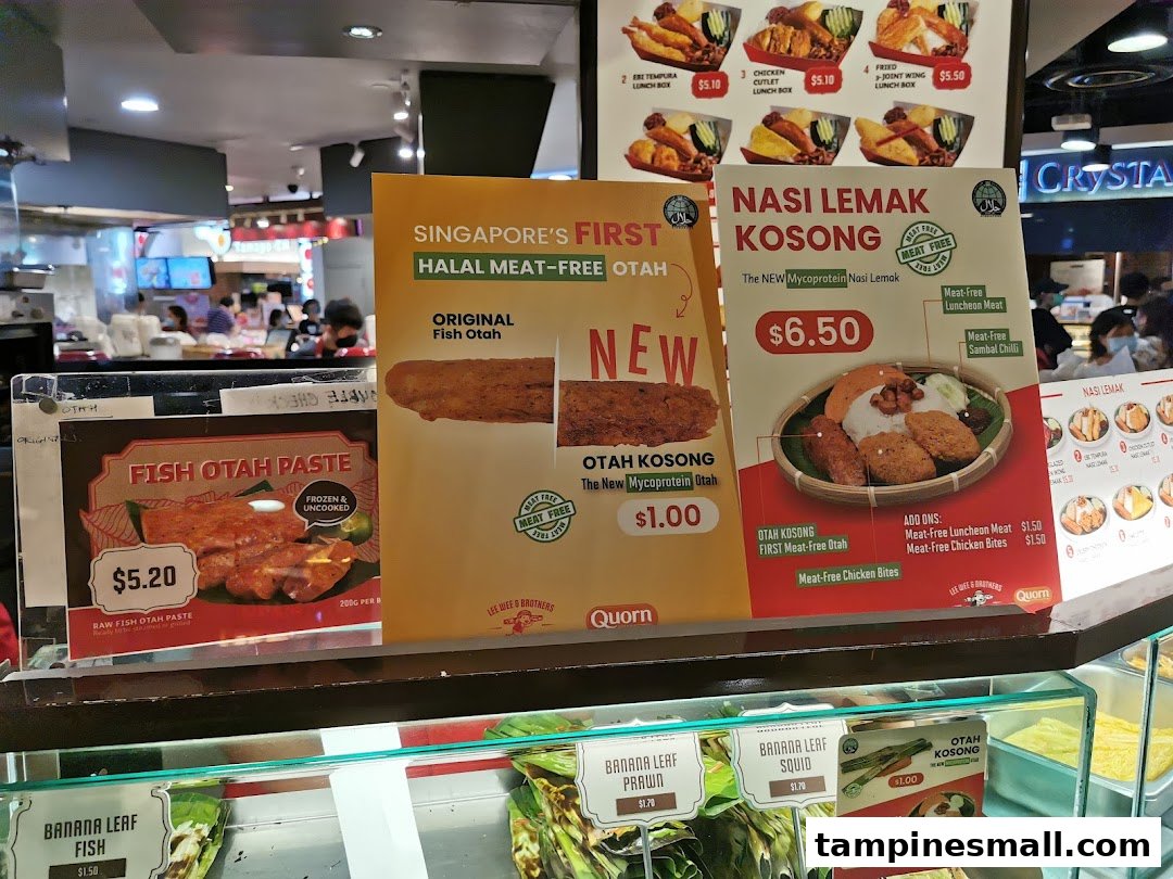 A display of menu items and promotional signs for Lee Wee Brothers, featuring Nasi Lemak and Otah.