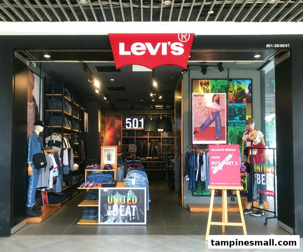 The Levi's store entrance showcasing denim apparel, mannequins, and promotional displays.