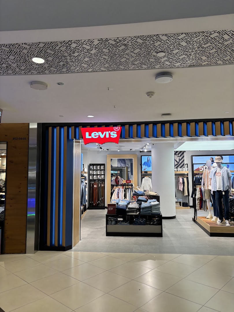 The Levi's store entrance at Tampines Mall, showcasing denim and apparel displays.