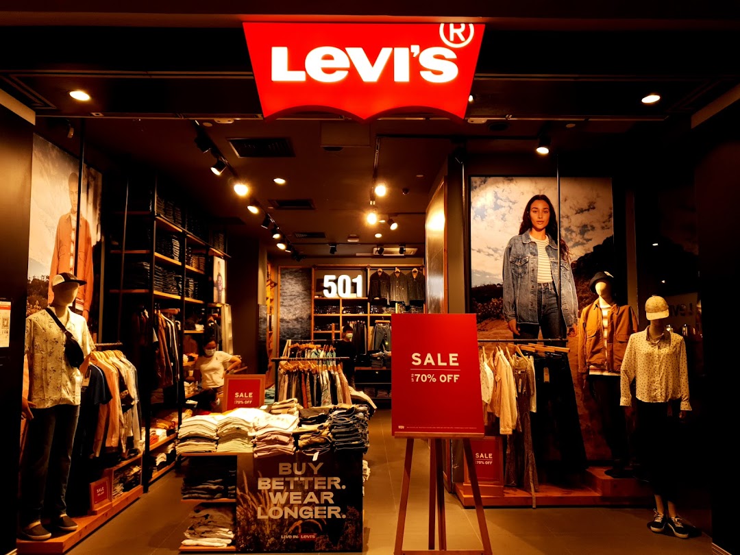 Interior view of Levi's Tampines Mall, showcasing denim apparel, mannequins, and a prominent sale sign.