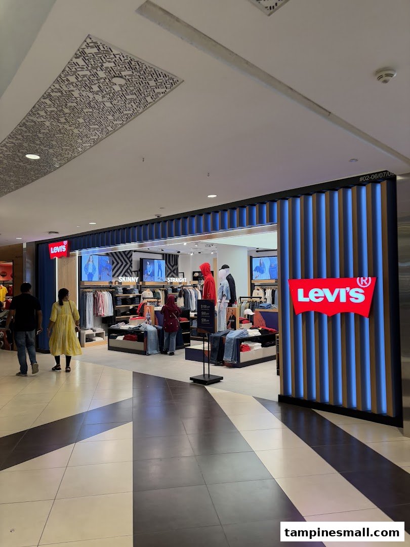 The image captures the vibrant entrance of a Levi's store, showcasing its denim collection and inviting interior.
