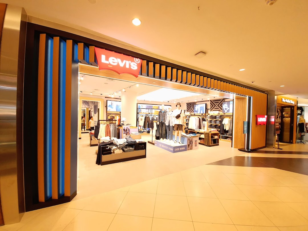 The image captures the inviting shop front of Levi's, showcasing its iconic logo and a glimpse of the stylish interior.