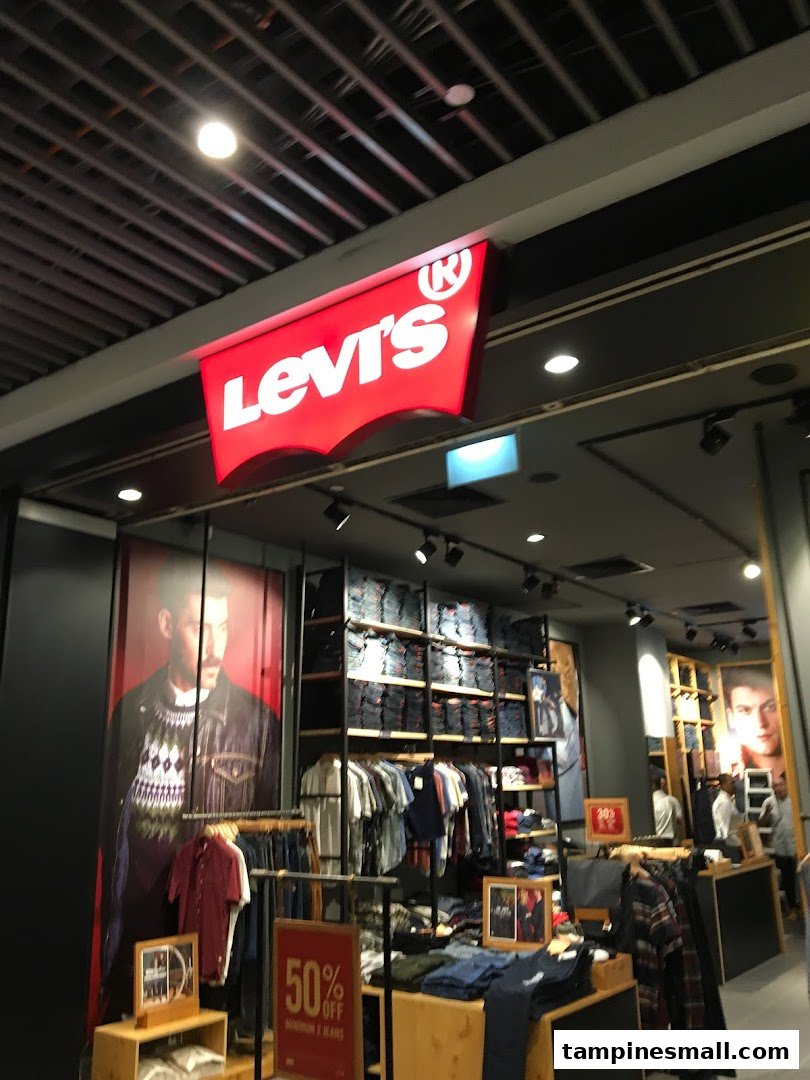 The image displays the vibrant red Levi's logo above the entrance of a well-stocked denim and apparel store.