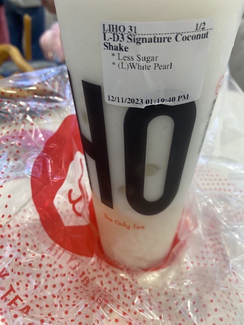 A close-up of a LiHO TEA Signature Coconut Shake with a customization label.