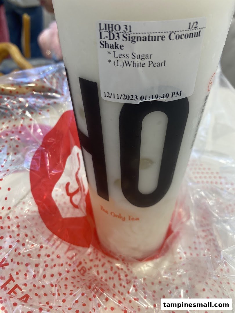 A close-up of a LiHO TEA Signature Coconut Shake with a customization label.