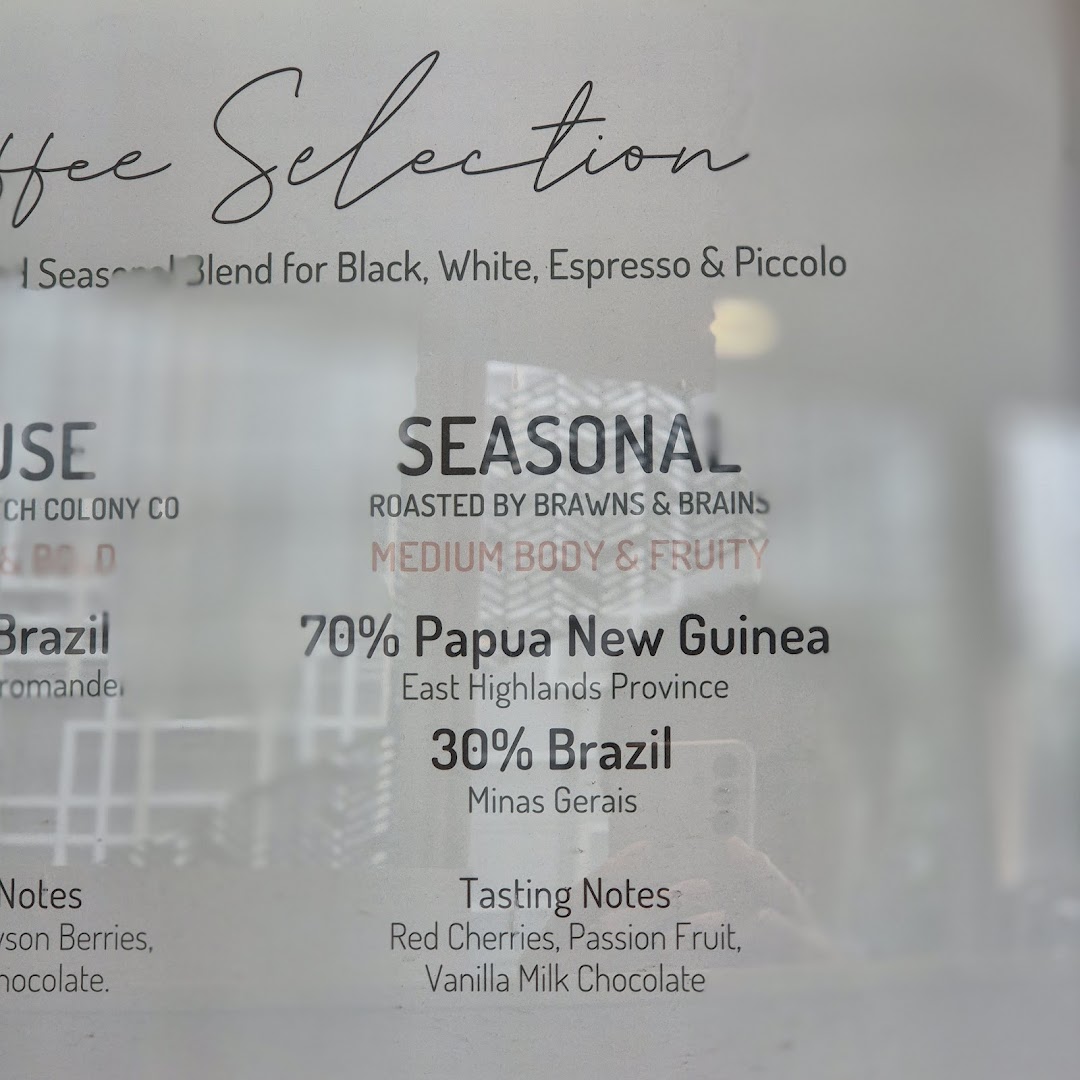A detailed display board showcasing Lolas' coffee selection, including seasonal blends and tasting notes.