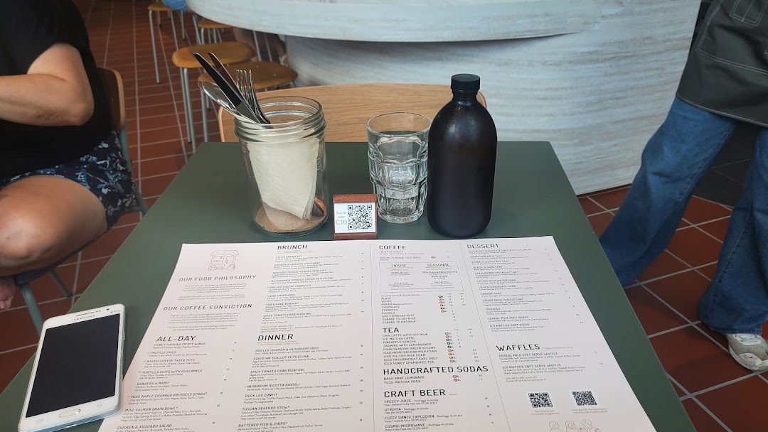 A detailed menu from Lolas cafe, featuring brunch, all-day, dinner, coffee, tea, sodas, craft beer, desserts, and waffles.