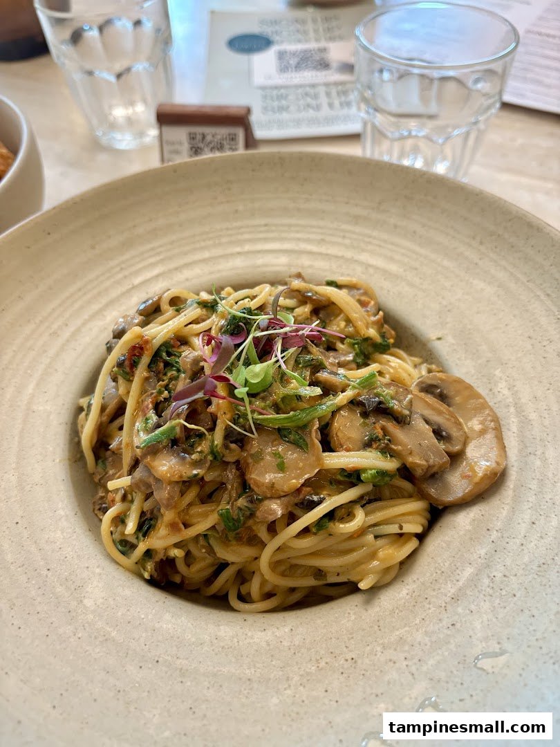 A close-up of a delicious mushroom pasta dish served in a rustic bowl at Lolas.