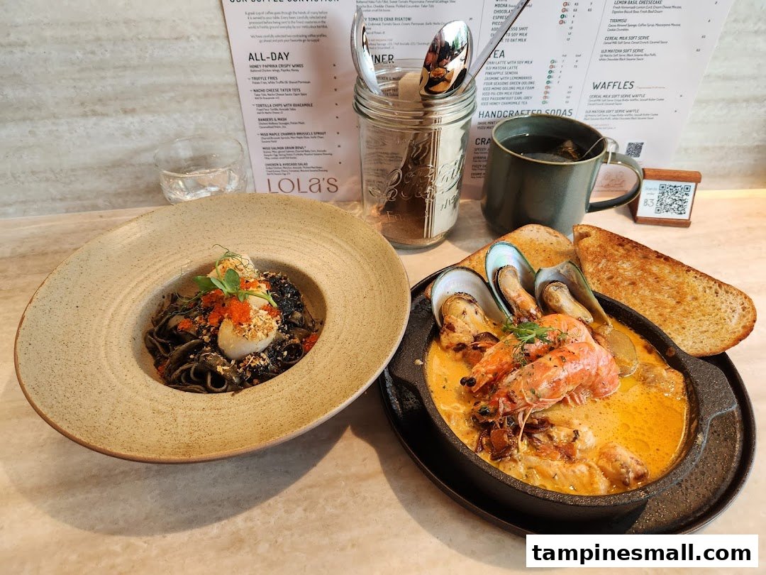 Delicious black pasta with scallops and a rich seafood stew with mussels and prawns from Lolas.