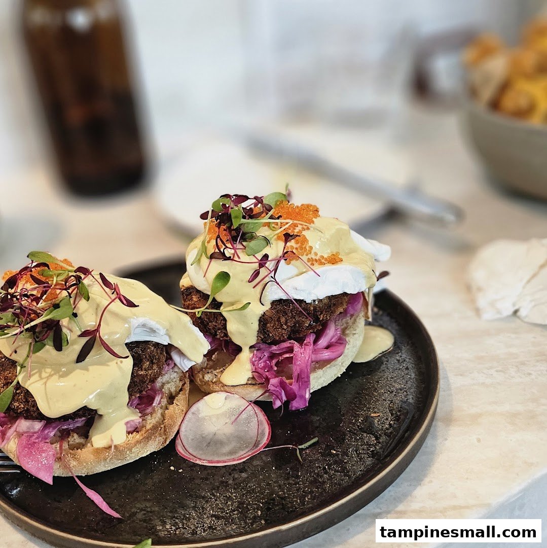 Two gourmet breakfast or brunch dishes featuring poached eggs, hollandaise, and microgreens on a dark plate.