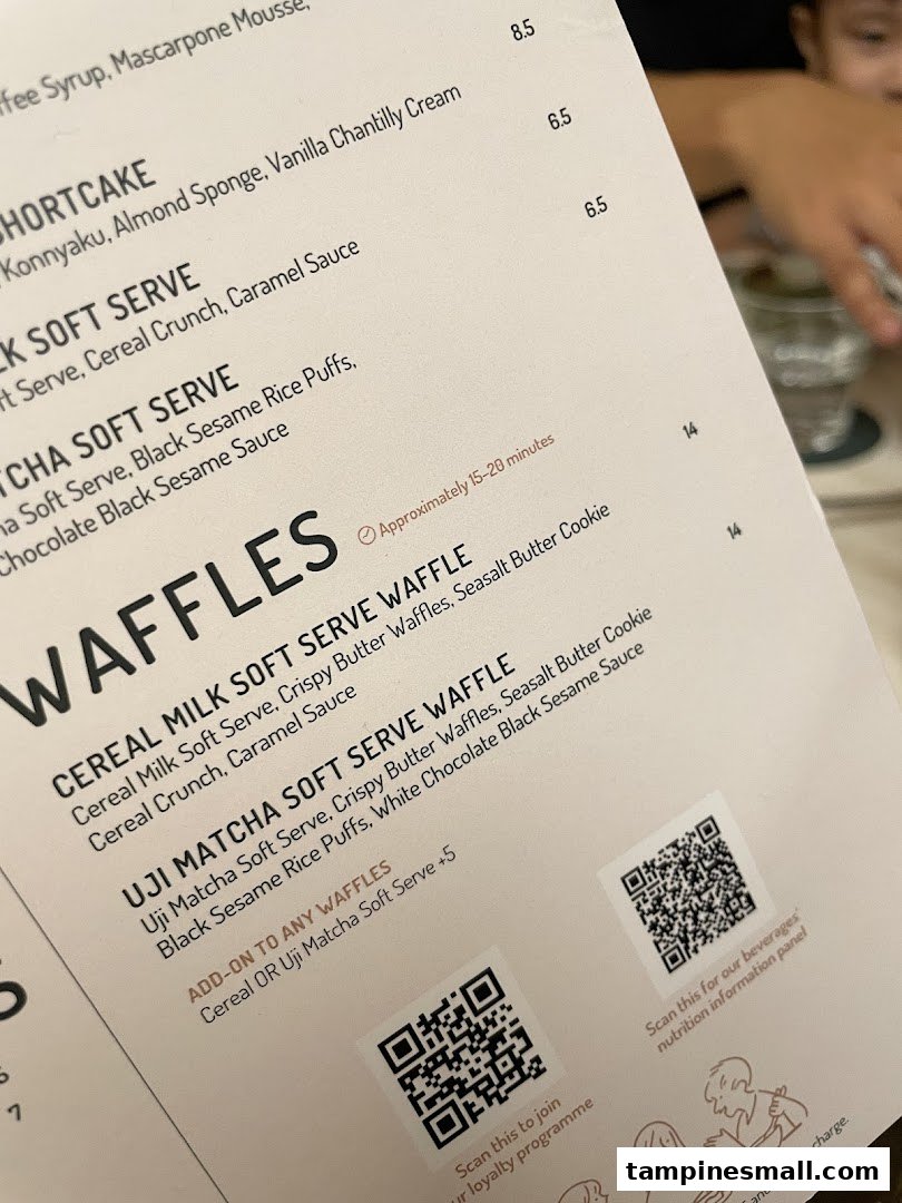A close-up view of Lola's dessert and waffle menu, showing various sweet treats and prices.