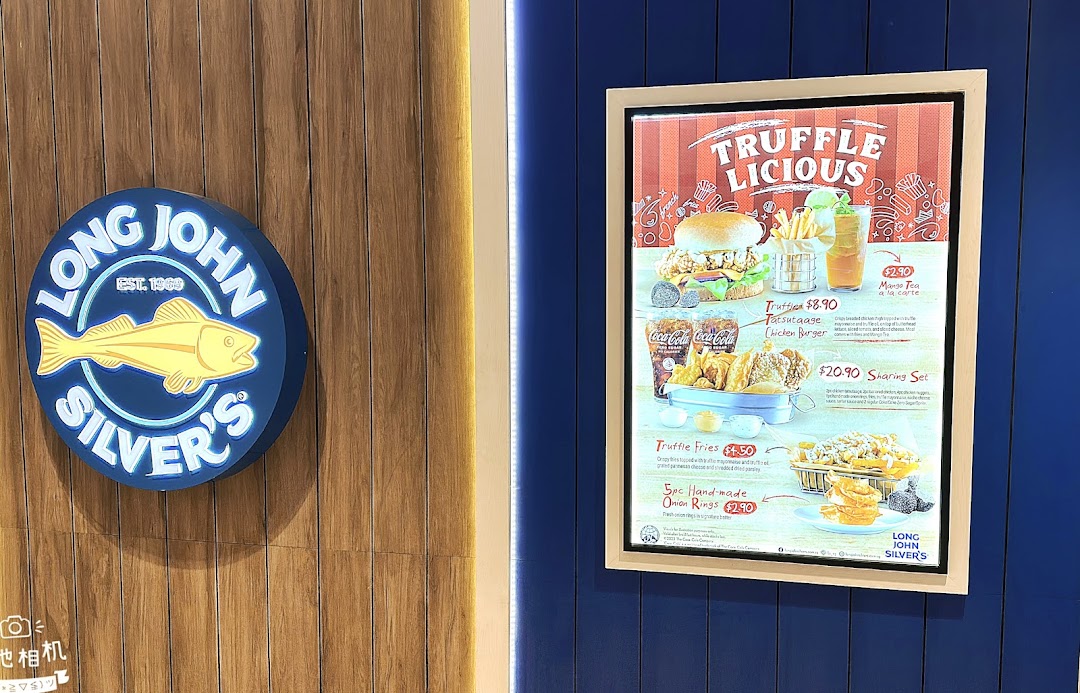 A promotional menu board for Long John Silver's featuring 'Truffle Licious' items and a shop logo.