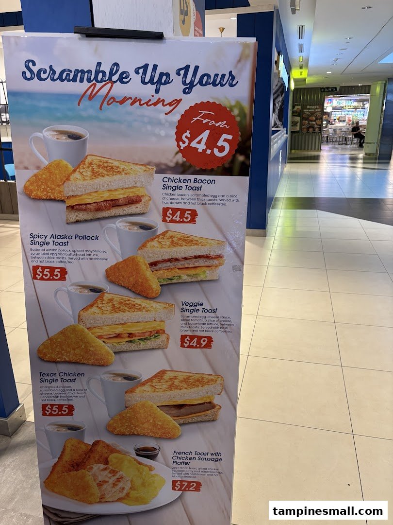 A vibrant breakfast menu stand showcasing various toast and platter options with prices.