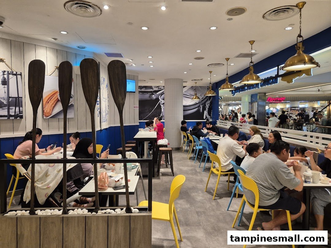 Customers enjoy meals in the nautical-themed interior of Long John Silver's restaurant.