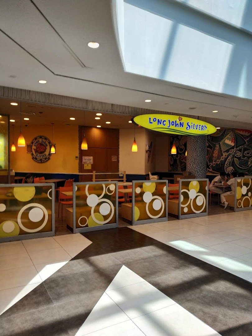 View of Long John Silvers' inviting dining area and entrance within a bustling mall.