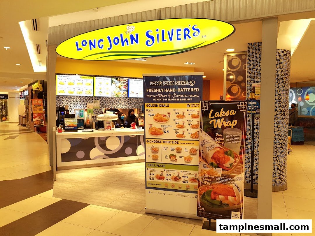 The brightly lit entrance of Long John Silver's, featuring its iconic yellow sign and promotional banners.
