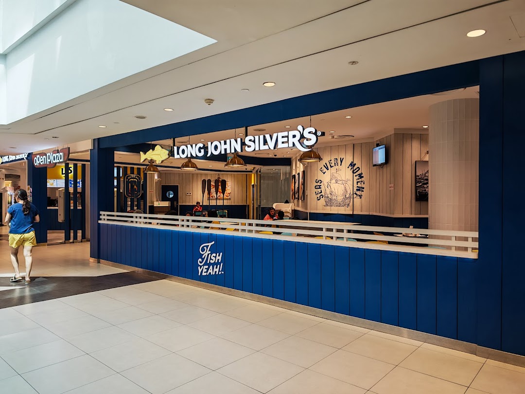 The vibrant blue and white facade of Long John Silver's restaurant within a bustling shopping mall.