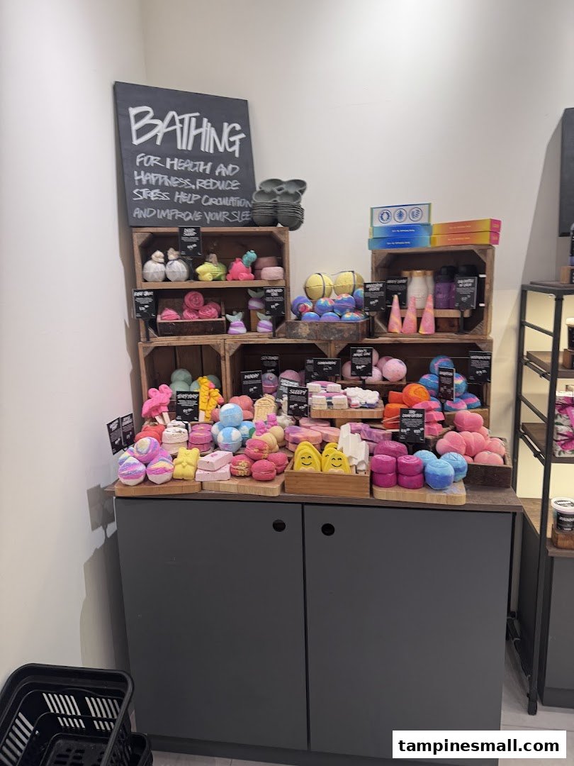 A vibrant display of Lush's handmade bath and body products, including colorful bath bombs and soaps.