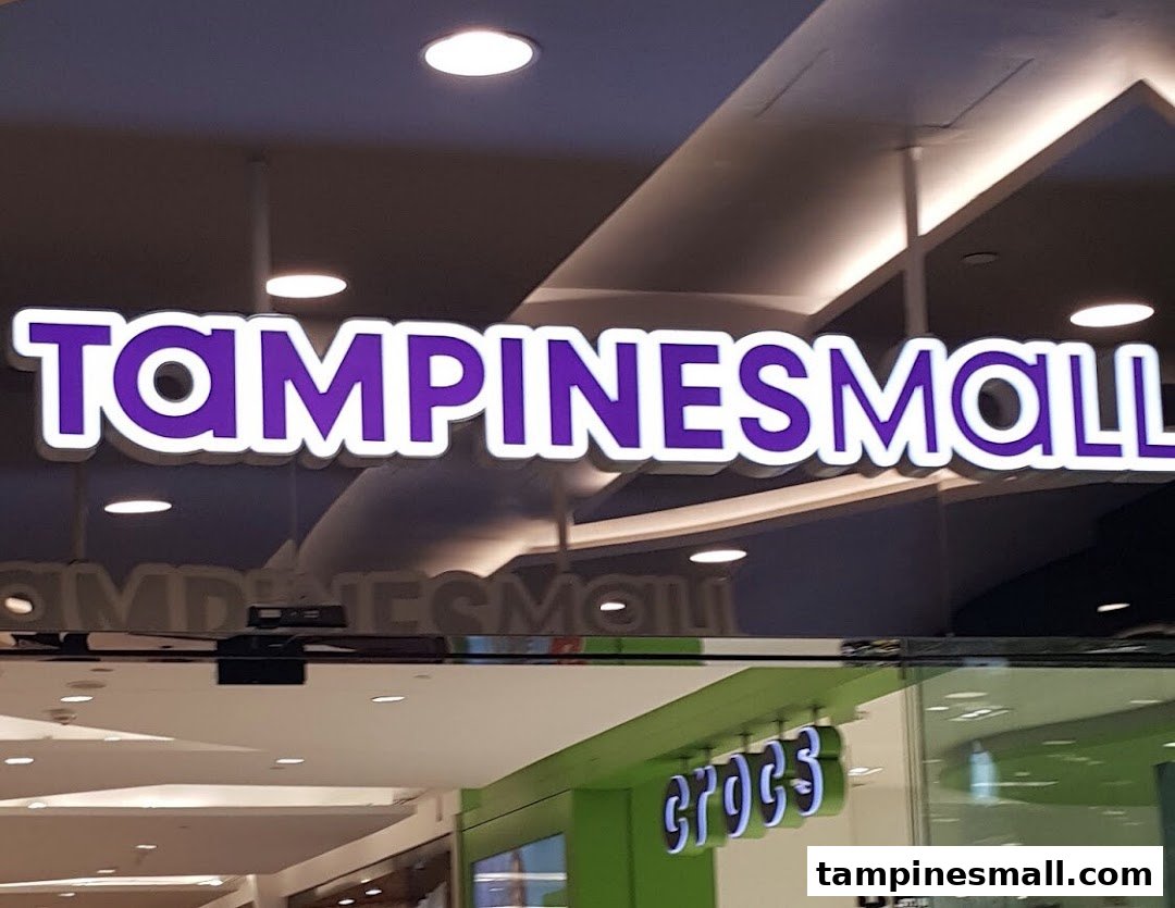 Illuminated 'TAMPINESMALL' sign and a 'CROCS' store sign visible inside the mall.
