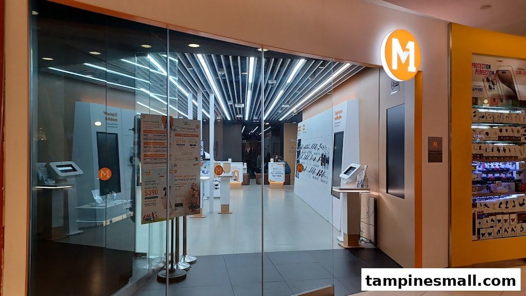 The brightly lit entrance of M1, a phone and internet service provider shop, is visible.