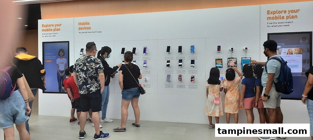 Customers browse mobile devices and explore plans at a modern phone shop.