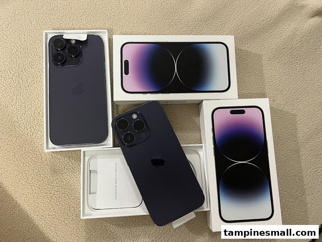 Several new iPhones in their packaging, showcasing the latest models and their boxes.