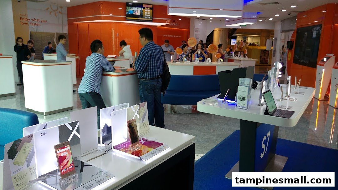 Interior of a vibrant phone and internet service provider shop with customers and product displays.