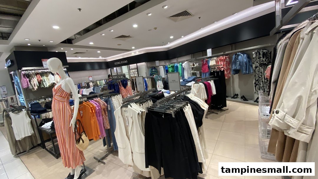 Interior view of a MANGO clothing store featuring diverse apparel on racks and a mannequin.