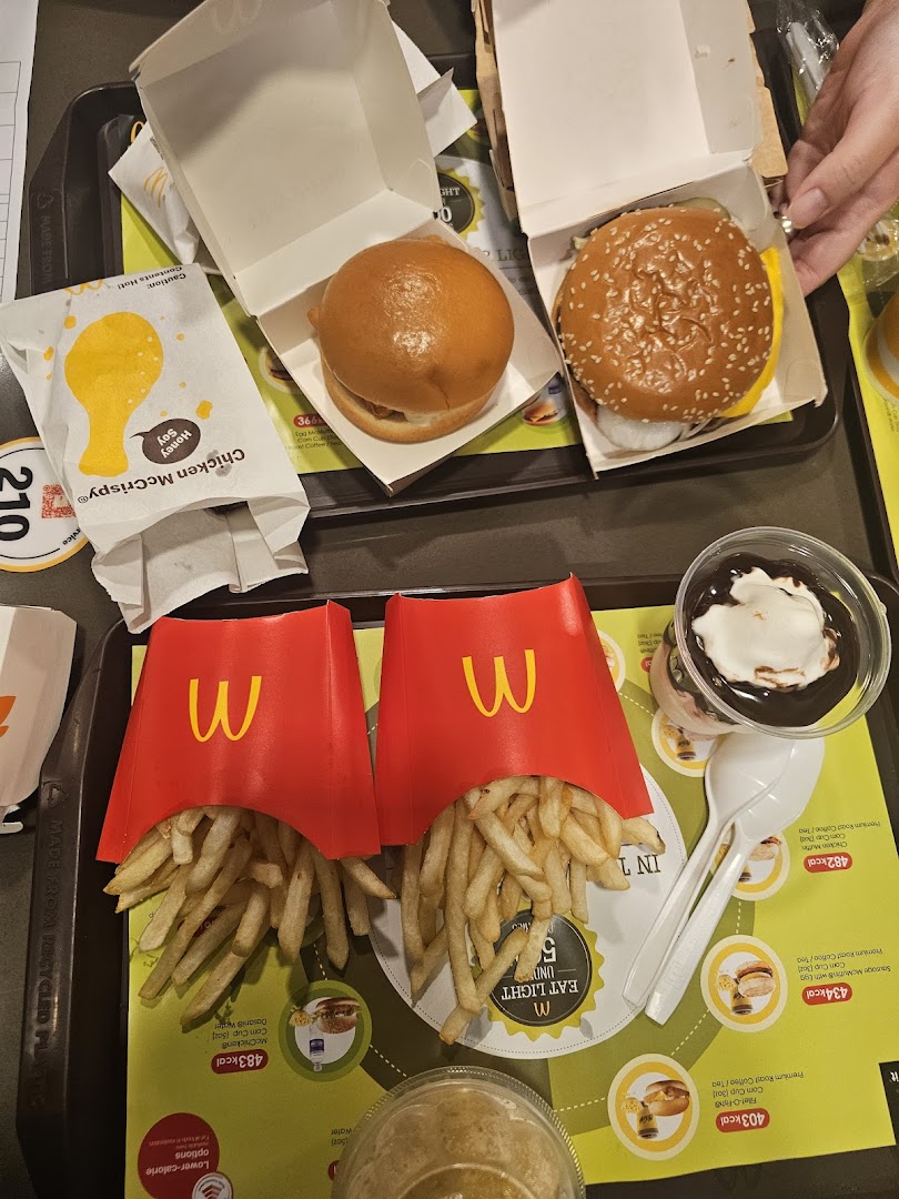A McDonald's meal featuring burgers, fries, and dessert on a tray.