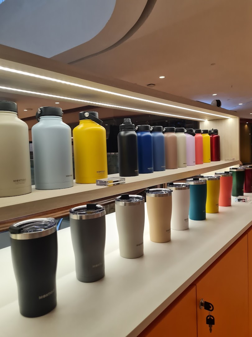 A vibrant display of Montigo insulated bottles and tumblers in various colors and sizes.