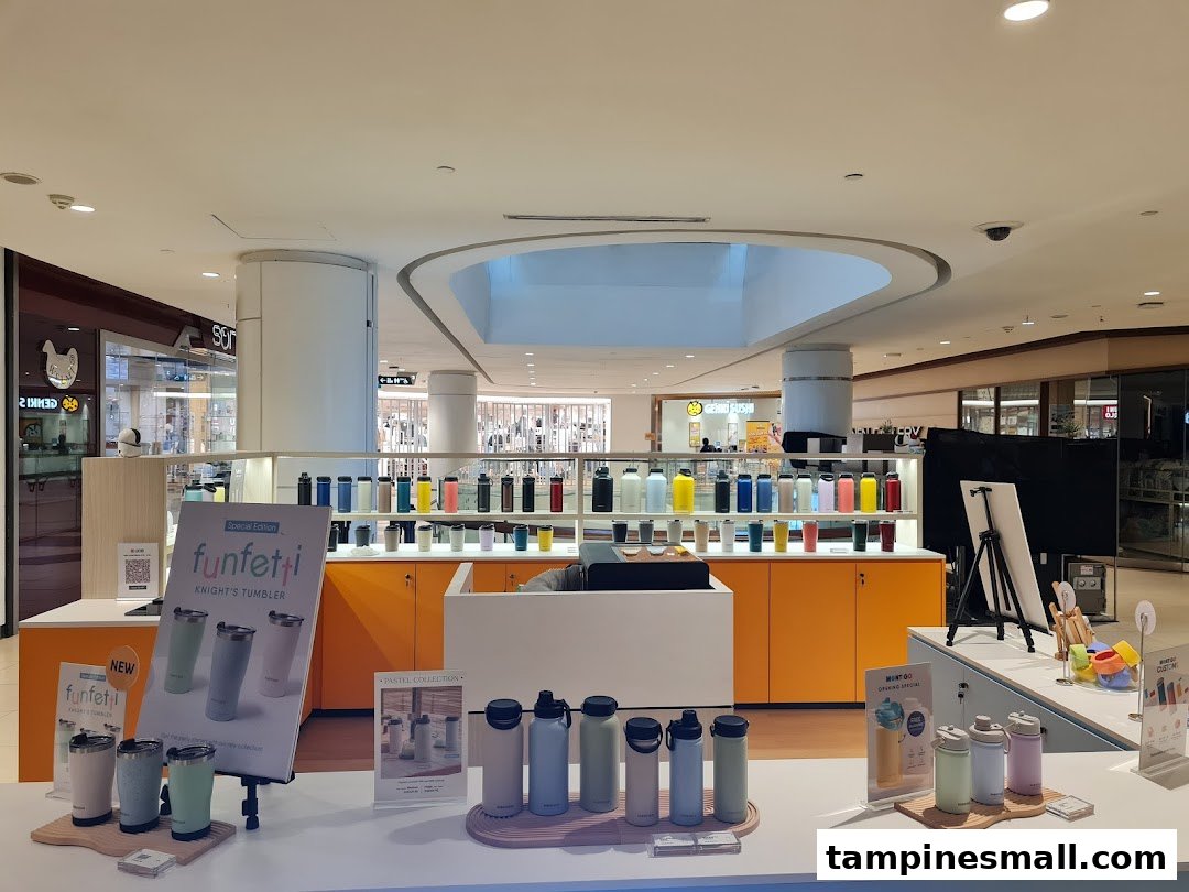 A vibrant display of colorful tumblers and bottles, showcasing various designs and collections in a retail store.