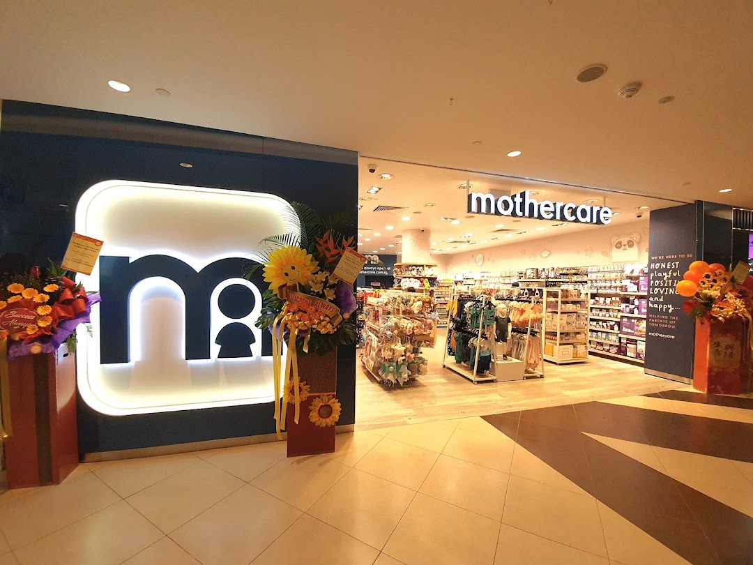 The brightly lit entrance of Mothercare at Tampines Mall, showcasing its wide range of baby and maternity products.