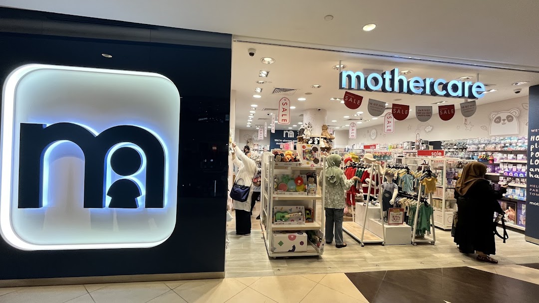 The Mothercare shop entrance at Tampines Mall, showcasing its logo, interior filled with baby products, and customers browsing.