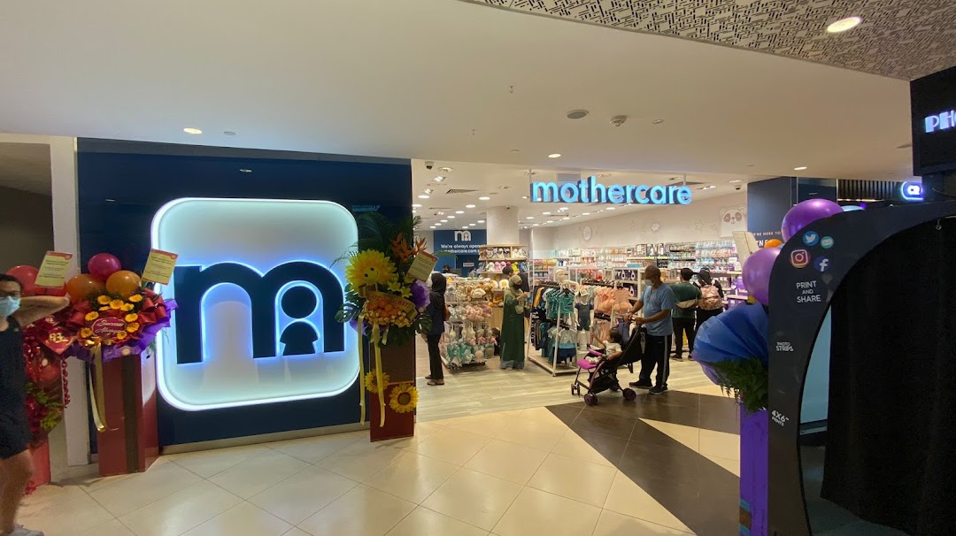The brightly lit entrance of Mothercare Tampines Mall, showcasing a wide range of baby and maternity products.