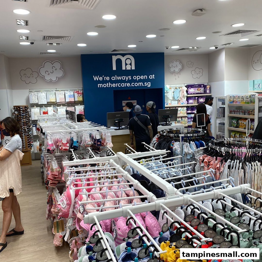 An interior view of Mothercare, showcasing a wide range of baby and children's clothing, footwear, and essentials.