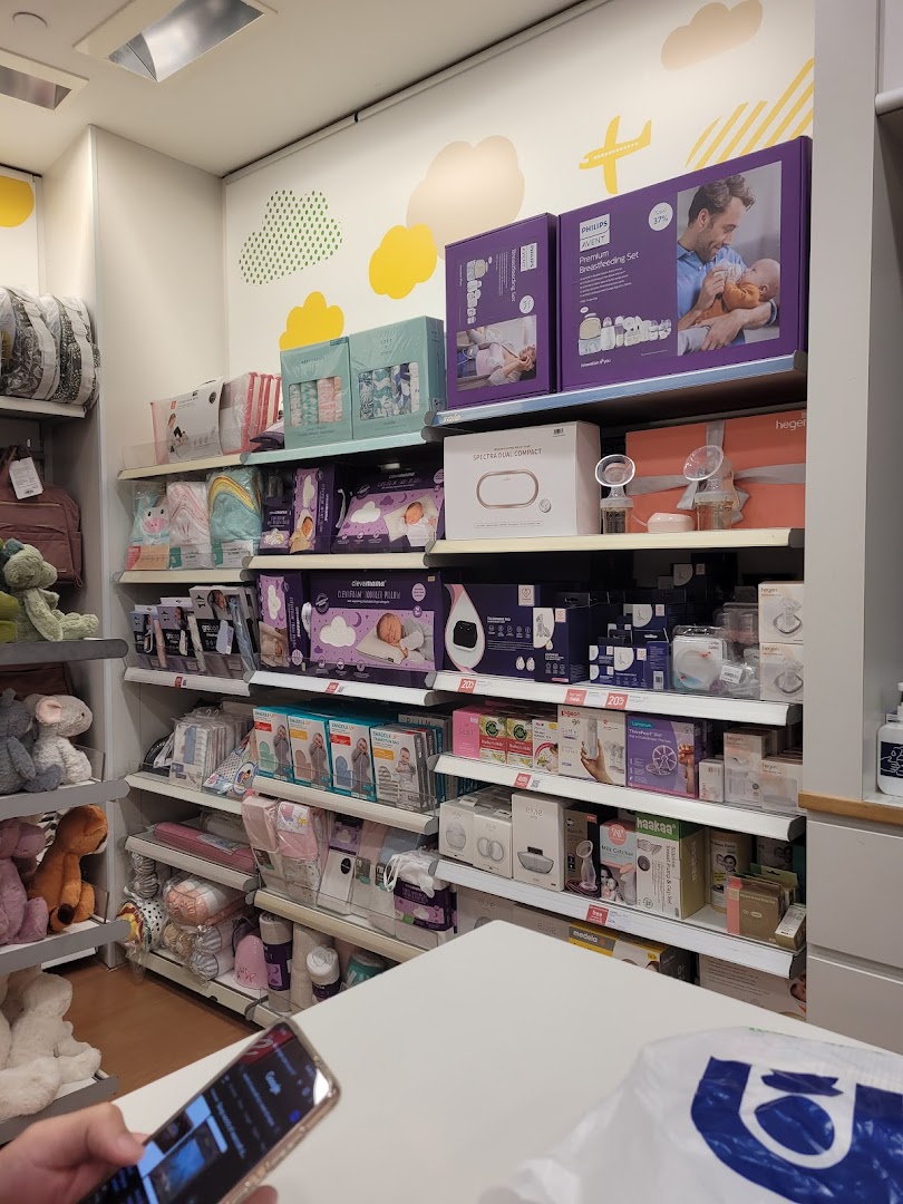 An interior view of Mothercare, showcasing shelves filled with baby products, feeding essentials, and accessories.